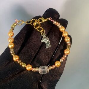 HONEYWISP — Handcrafted Gold & Metallic Glass Beaded Bracelet with Bear Charm